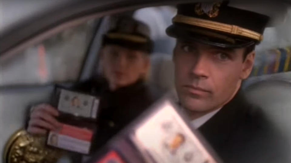 David James Elliott shows his ID in uniform in JAG.