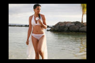 Mugdha Godse sports a white bikini in 'Help', but it did not do much to help the movie from sinking without a trace.