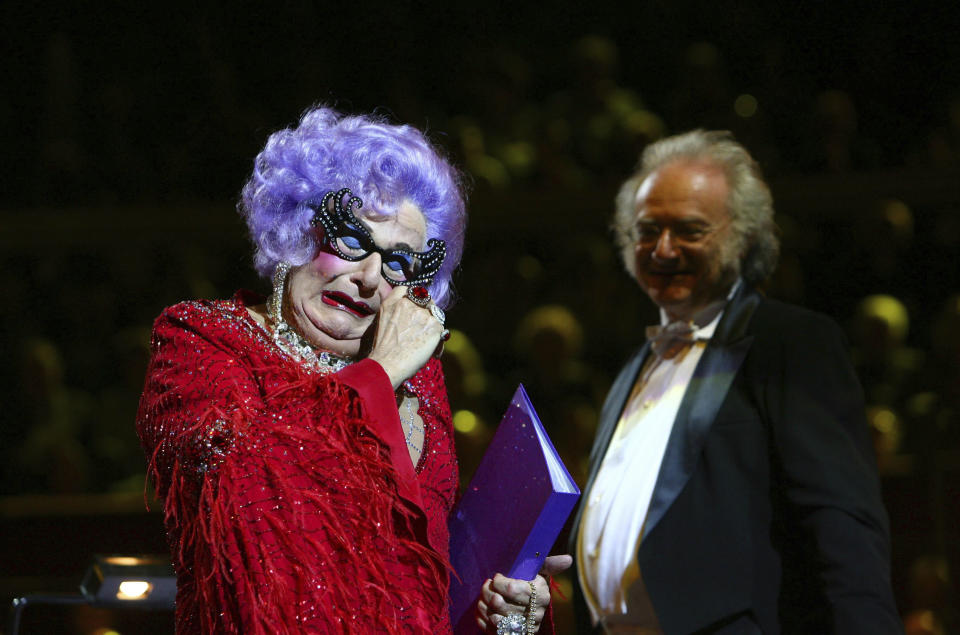 FILE - Actor Barry Humphries as Dame Edna Everage performs at the Last Night of the BBC Poms at the Royal Albert Hall, London, Sept. 15, 2009. Tony Award-winning comedian Barry Humphries, internationally renowned for his garish stage persona Dame Edna Everage, a condescending and imperfectly-veiled snob whose evolving character has delighted audiences over seven decades, has died on Saturday, April 22, 2023, after spending several days in a Sydney hospital with complications following hip surgery, a Sydney hospital said. ( Johnny Green/PA via AP, File)