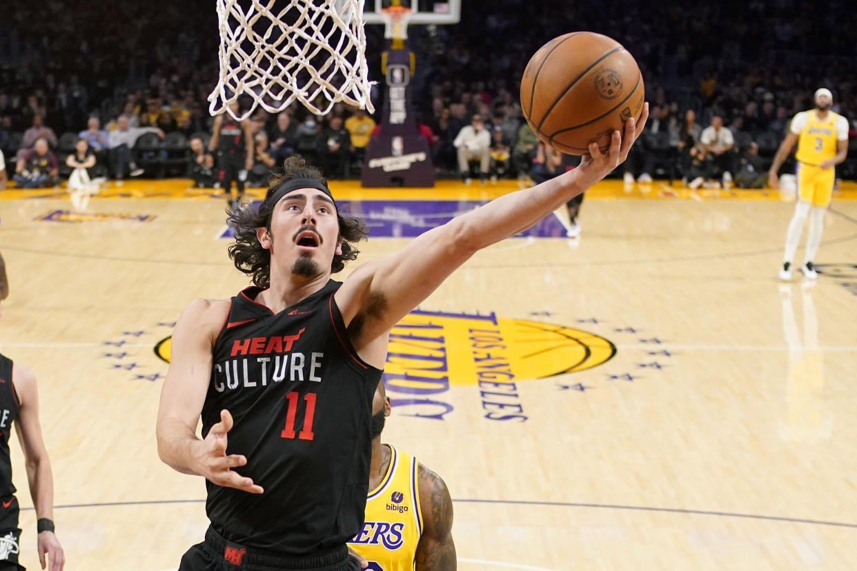 Miami Heat guard Jaime Jaquez Jr., left, shoots as Los Angeles Lakers forward LeBron James defends during the first half of an NBA basketball game Wednesday, Jan. 3, 2024, in Los Angeles. (AP Photo/Mark J. Terrill)