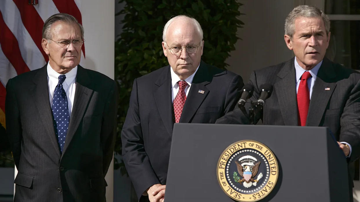 President Bush along with Secretary of Defense Donald H. Rumsfeld, left, and Vice President Dick Cheney, makes a statement on the war on terror, Sept. 28, 2005, at the White House.