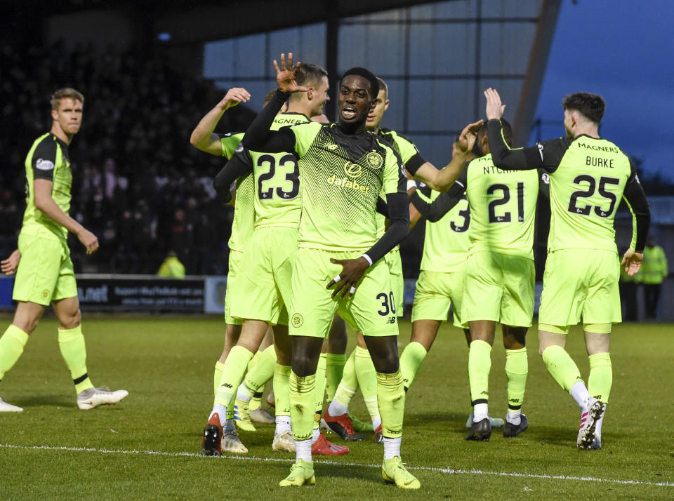 Celtic's Timothy Weah, center, celebrates scoring his side's first goal of the game during the Scottish Premier League soccer match against St Mirren Wednesday April 3, 2019. American forward Tim Weah scored in his first start in two months, helping Celtic win 2-0 at St. Mirren in the Scottish Premier League. (Ian Rutherford/PA via AP)