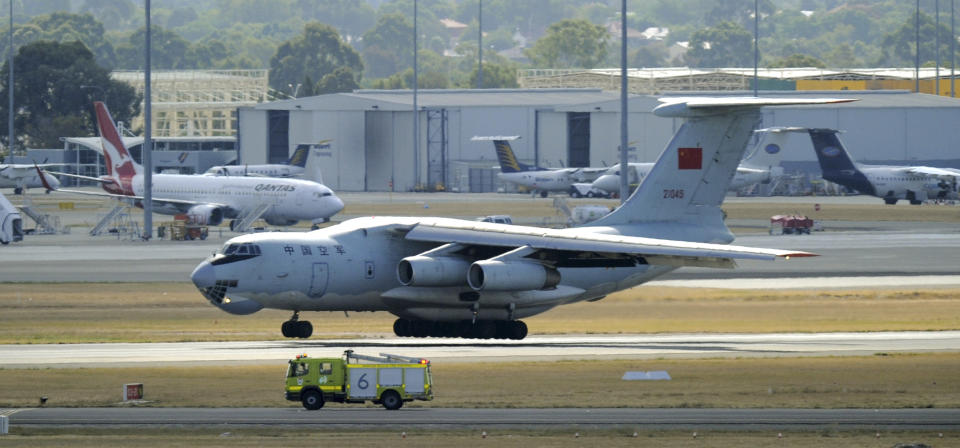 A Chinese Ilyushin IL-76 aircraft returns to Perth, Australia, International Airport Wednesday, April 16, 2014, to assist in the search for the missing Malaysia Airlines Flight 370 in the southern Indian Ocean. A robotic submarine looking for the lost Malaysian jet is continuing its second seabed search as up to 14 planes were to take to the skies for some of the final sweeps of the Indian Ocean for floating debris from the ill-fated airliner. (AP Photo/Greg Wood, Pool)