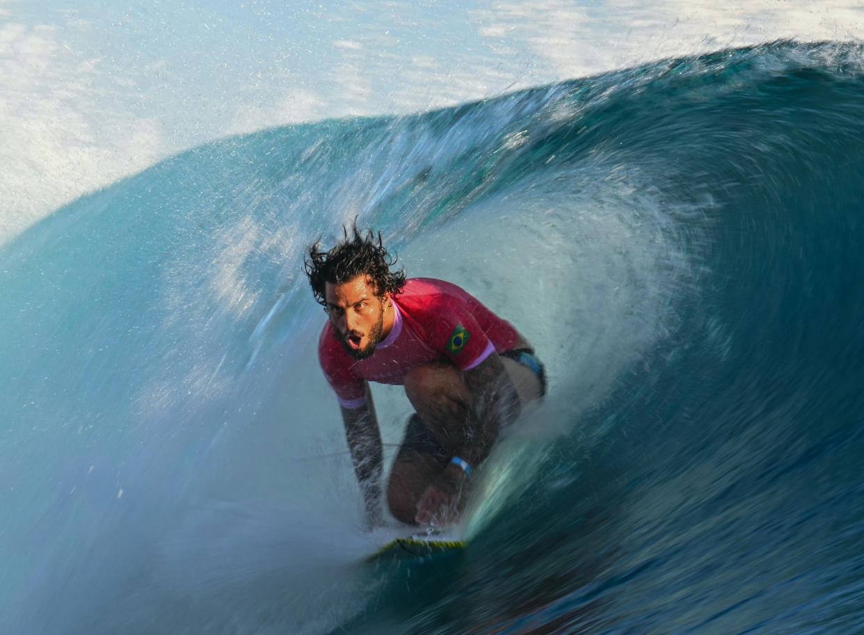 Brazil's Filipe Toledo  exits the barrel surfing in Teahupo'o, on the French Polynesian Island of Tahiti.