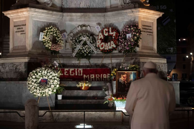 Pope Francis prays in front of the Column of the Virgin Mary, near the Spanish Steps, in Rome