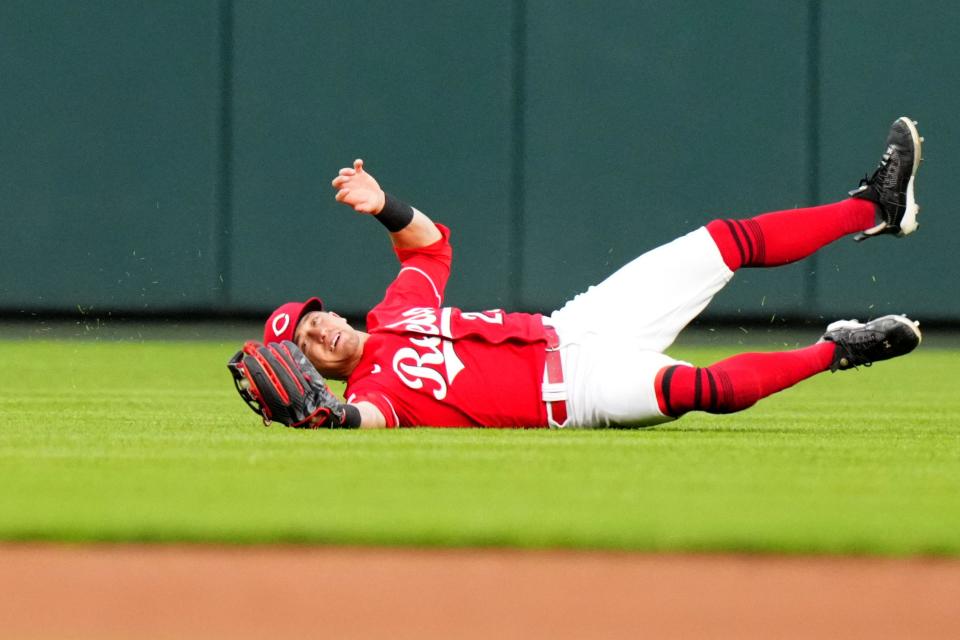 Cincinnati Reds center fielder TJ Friedl (29) completes a diving catch in the fifth inning during a baseball game between the Chicago White Sox and the Cincinnati Reds, Saturday, May 6, 2023, at Great American Ball Park in Cincinnati. 