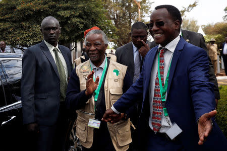 A protocol officer welcomes former South African President Thabo Mbeki at the IEBC National Tallying centre at the Bomas of Kenya, in Nairobi, Kenya August 11, 2017. REUTERS/Thomas Mukoya