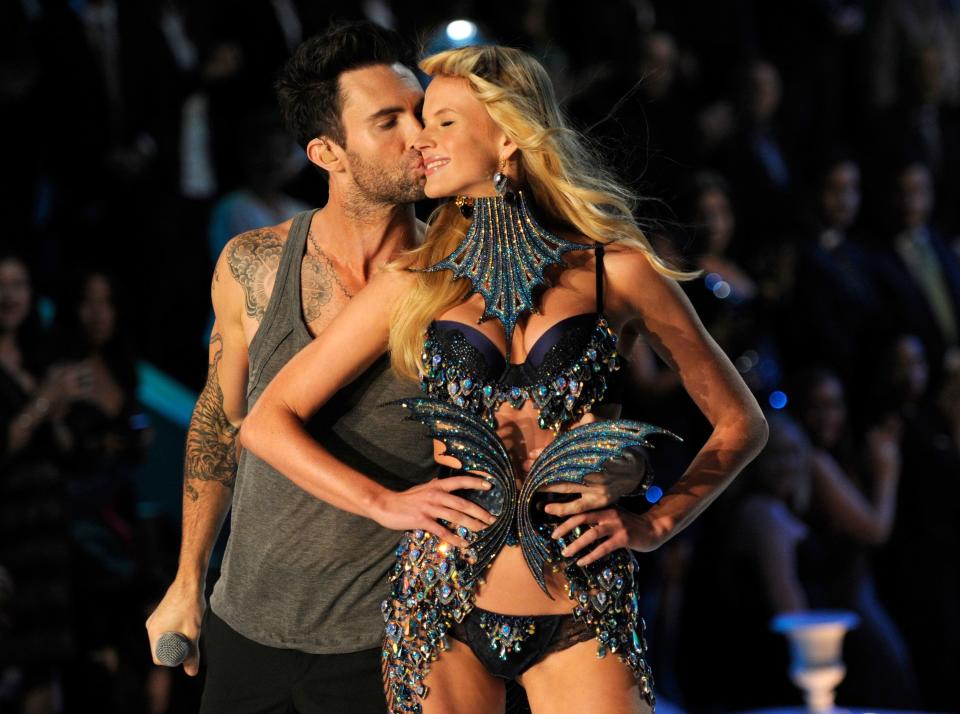 Adam Levine kissing Anne Vyalitsyna on the cheek during Victoria's Secret fashion show