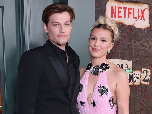 <p>Monica Schipper/Getty</p> Jake Bongiovi and Millie Bobby Brown together at the premiere of 'Enola Holmes 2.'