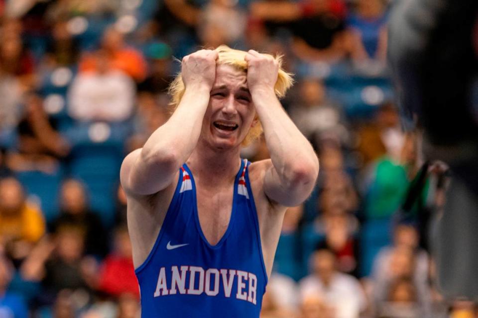 Andover junior Luke Potter celebrates a dramatic, last-second victory in the 132-pound finals at the Class 5A state tournament at Hartman Arena on Saturday.