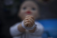 A baby doll symbolizing the small children who were abducted by Hamas militants during the group's Oct. 7 attack on Israel is displayed at a vigil for the victims in central Tel Aviv, Israel, Friday, Nov. 10, 2023. (AP Photo/Oded Balilty)