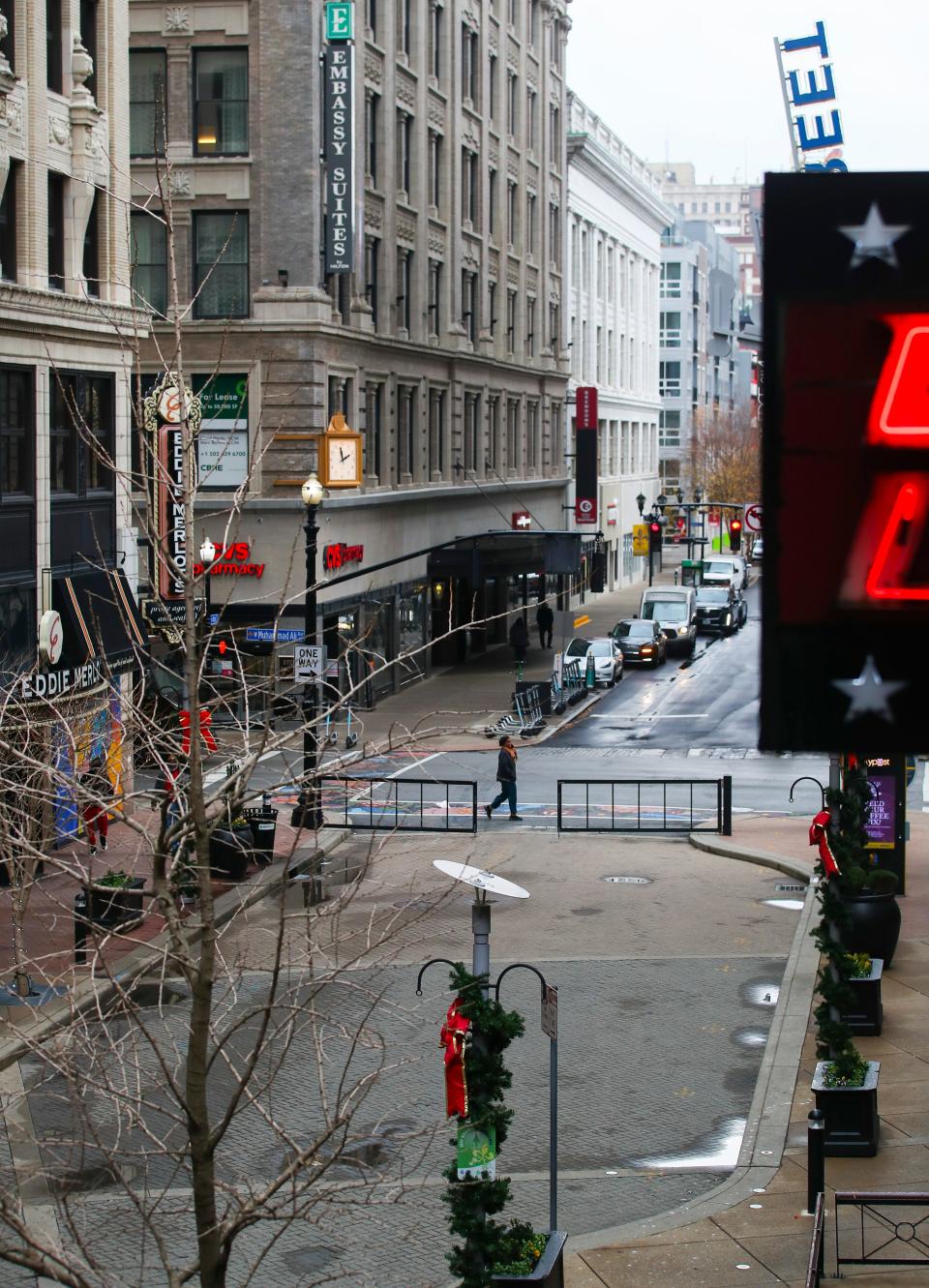 A few pedestrians along Fourth Street on a December afternoon recently. Downtown Louisville has experienced fewer people since 2020, according to a study of cell phone traffic. Dec. 5, 2023