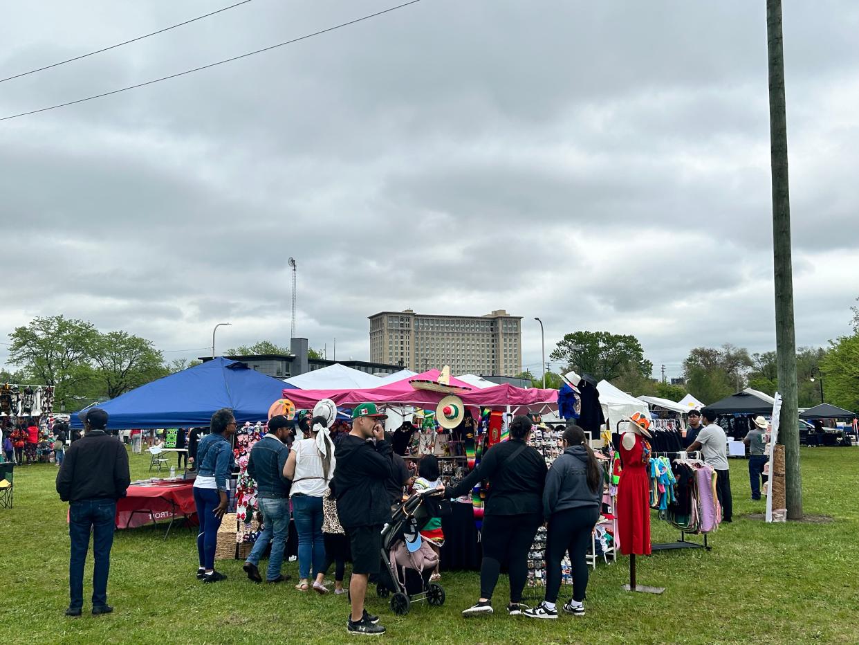 Families gather outside of the Michigan Welcome Center on Sunday for the second day of festivities for the 59th annual Cinco de Mayo parade and festival.