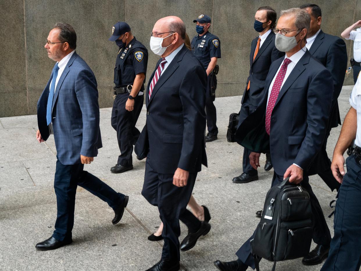 The Trump Organization's Chief Financial Officer Allen Weisselberg, center, leaves after a courtroom appearance in New York, Monday, Sept. 20, 2021 (AP)