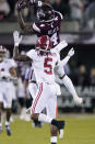 Mississippi State wide receiver Malik Heath (4) pulls in a pass reception for short yardage in front of Alabama defensive back Jalyn Armour-Davis (5) during the first half of an NCAA college football game in Starkville, Miss., Saturday, Oct. 16, 2021. (AP Photo/Rogelio V. Solis)