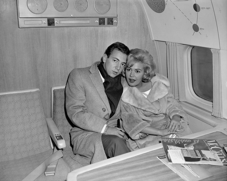 <p>One of the major "It" couples of the era honeymooned in a place they were already familiar with: Hollywood. Here, they're pictured flying out of New Jersey, where their wedding was held.</p>