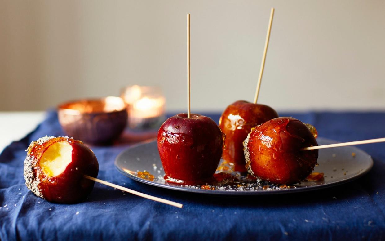 Crisp apples dunked in molten sugar for a classic treat - Yuki Sugiura