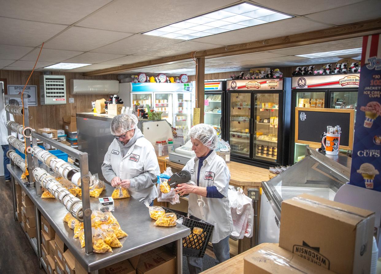 Store manager Rhonda Eppers and coworker Karen Brecke finish the process and bag freshly made cheese curds at Nasonville Dairy in Curtiss, Wisconsin on Friday, March 22, 2024. Gabi Broekema/USA TODAY NETWORK- Wisconsin