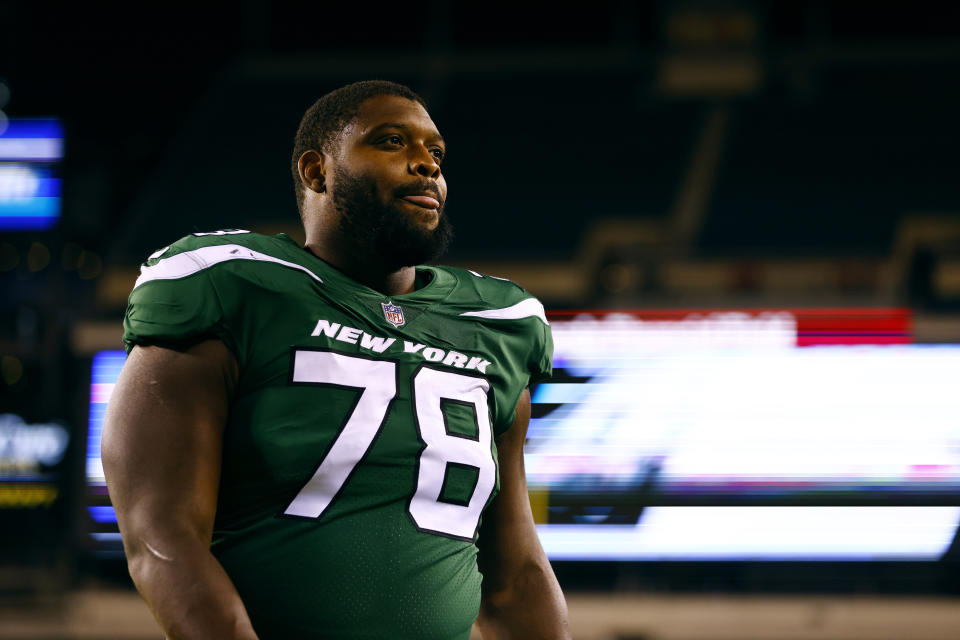 FILE - New York Jets guard Laken Tomlinson (78) walks off the field after an NFL preseason game against the Philadelphia Eagles, Friday, Aug. 12, 2022, in Philadelphia. “Moving's the worst, man,” New York Jets left guard Laken Tomlinson said. Dealing with realtors, lawyers, mortgage brokers and closings in a new city is stressful enough. For NFL players, juggling the uncertainty of their job situation makes it even more nerve-wracking. (AP Photo/Rich Schultz, File)