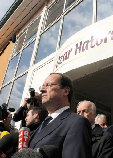 France's opposition Socialist Party presidential candidate Francois Hollande (C) speaks to journalists, in front of the "Ozar Hatorah" Jewish school where four people were killed