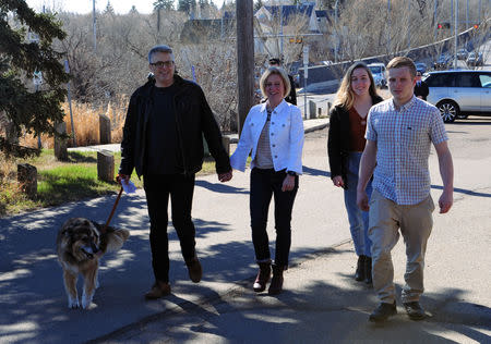 Alberta New Democratic (NDP) leader and Premier Rachel Notley arrives at the polling station with her husband Lou Arab, daughter Sophie Arab, 18, son Ethan Notley, 20 and dog Tucker to cast their ballots during the provincial election in Edmonton, Alberta, Canada, April 16, 2019. REUTERS/Candace Elliott