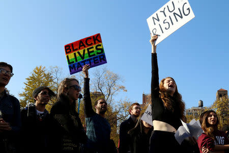 Students of New York University (NYU) hold signs during a demonstration joining with other colleges across the nation participating in #SanctuaryCampus, a protest against President-elect Donald Trump in Manhattan, New York, U.S. on November 16, 2016. REUTERS/Bria Webb/File Photo