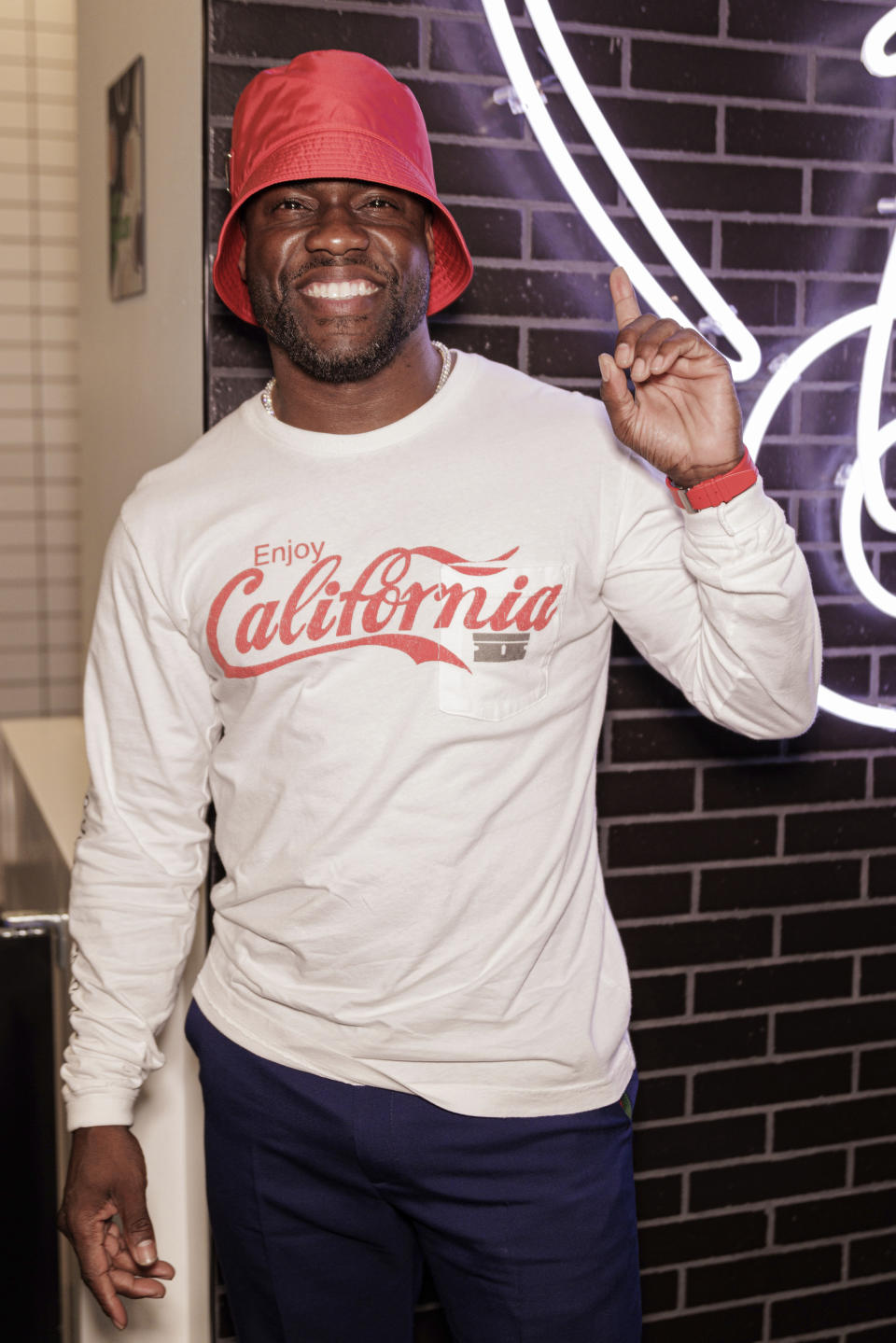 Kevin Hart poses for a portrait at the opening of his new vegan fast-food restaurant "Hart House" on Wednesday, Aug. 24, 2022 in Los Angeles. (Photo by Willy Sanjuan/Invision/AP).