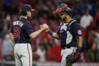 Washington Nationals' Kyle Finnegan, left, and Keibert Ruiz celebrate their win over the Cincinnati Reds at the end of a baseball game Thursday, Sept. 23, 2021, in Cincinnati. The Nationals beat the Reds 3-2. (AP Photo/Jay LaPrete)