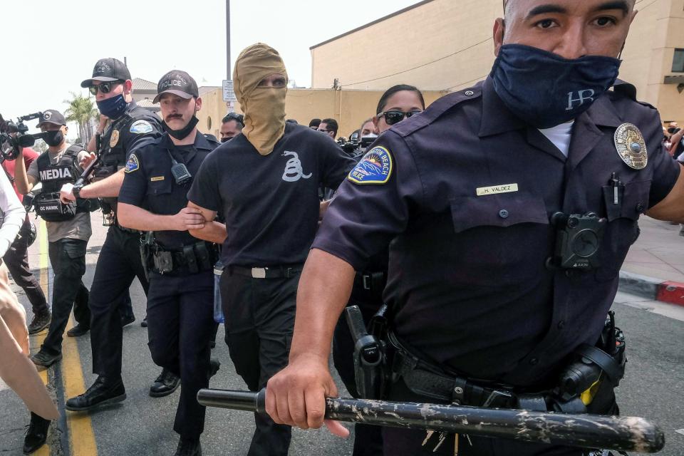 Image: White Lives Matter protests in Huntington Beach (Ringo Chiu / Reuters)