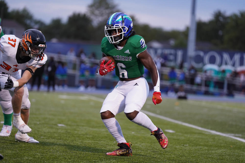 Winton Woods' James Minor III looks for an opening Friday night, Sept. 23, at Winton Woods.