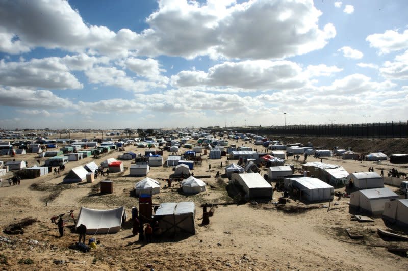 A tent camp shelters refugees who have fled fighting between Israeli and Palestinian forces in Rafah in the southern Gaza Strip on Thursday. Photo by Ismael Mohamad/UPI