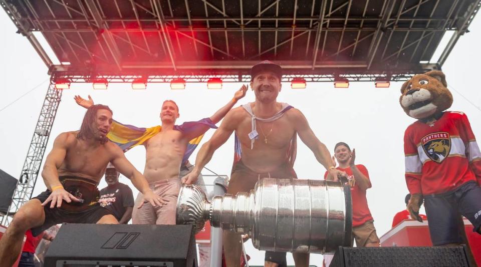 Florida Panthers goaltender Sergei Bobrovsky (72) prepares to lift the Stanley Cup during a victory parade rally at the Fort Lauderdale Beach Park off A1A on Sunday, June 30, 2024, in Fort Lauderdale, Fla. The parade was held to celebrate the Florida Panthers after they defeated the Edmonton Oilers in Game 7 of the Stanley Cup Final.