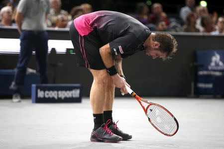 Stan Wawrinka of Switzerland reacts during his lost to World number one Novak Djokovic of Serbia in their men's singles semi-final tennis match at the Paris Masters tennis tournament at the Bercy sports hall in Paris, France, November 7, 2015. REUTERS/Charles Platiau