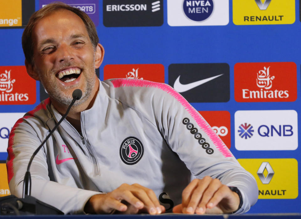 PSG's coach Thomas Tuchel laughs during a press conference at the club training center in Saint Germain en Laye, west of Paris, Friday, Aug.17, 2018. Paris Saint Germain will play Guingamp Saturday in a French League One match. (AP Photo/Michel Euler)