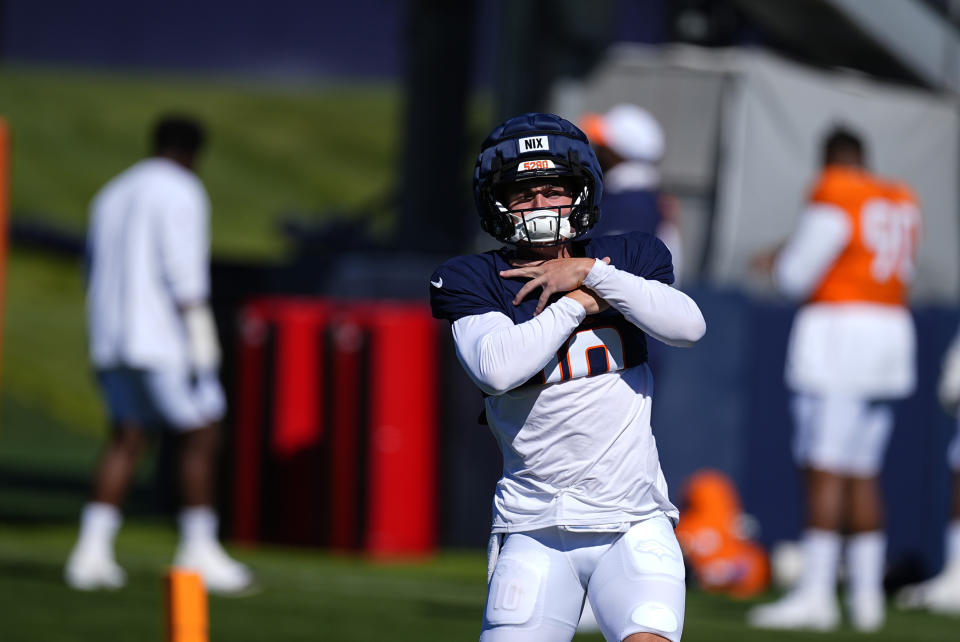 No, Bo Nix is not choking away a starting spot. He's simply amidst a time-honored NFL training camp tradition. (AP Photo/David Zalubowski)