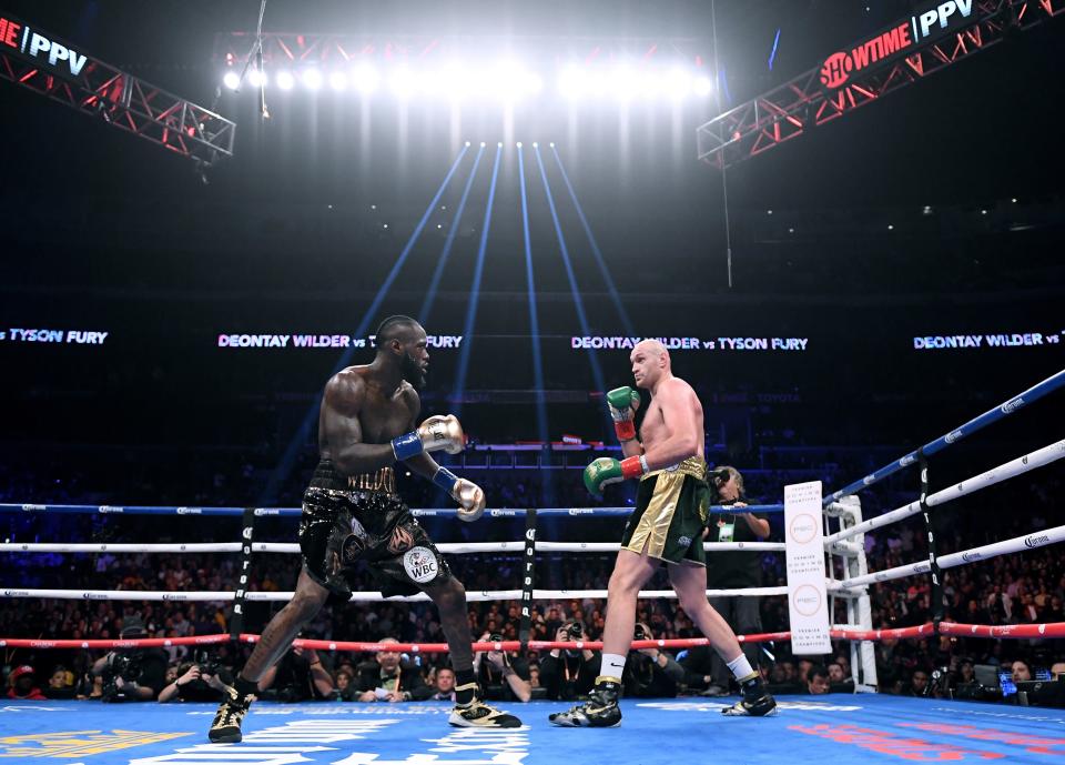 LOS ANGELES, CA - DECEMBER 01:  Tyson Fury and Deontay Wilder in the first round, fighting to a draw during the WBC Heavyweight Championship at Staples Center on December 1, 2018 in Los Angeles, California.  (Photo by Harry How/Getty Images)