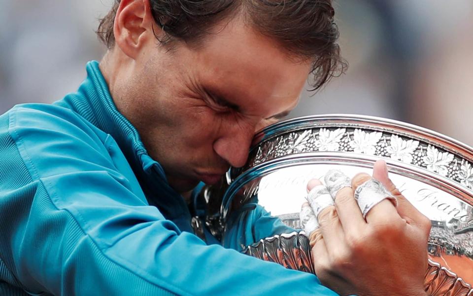 Rafa Nadal celebrates his 11th French Open title - REUTERS