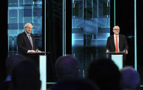 In this photo issued by ITV, Boris Johnson, left, and Jeremy Corbyn, during their election head-to-head debate live on TV, in Manchester, England, Tuesday, Nov. 19, 2019. Prime Minister Boris Johnson and Jeremy Corbyn are set to go head-to-head in their first live televised debate Tuesday evening, as the UK prepares for a General Election on Dec. 12. (ITV via AP)
