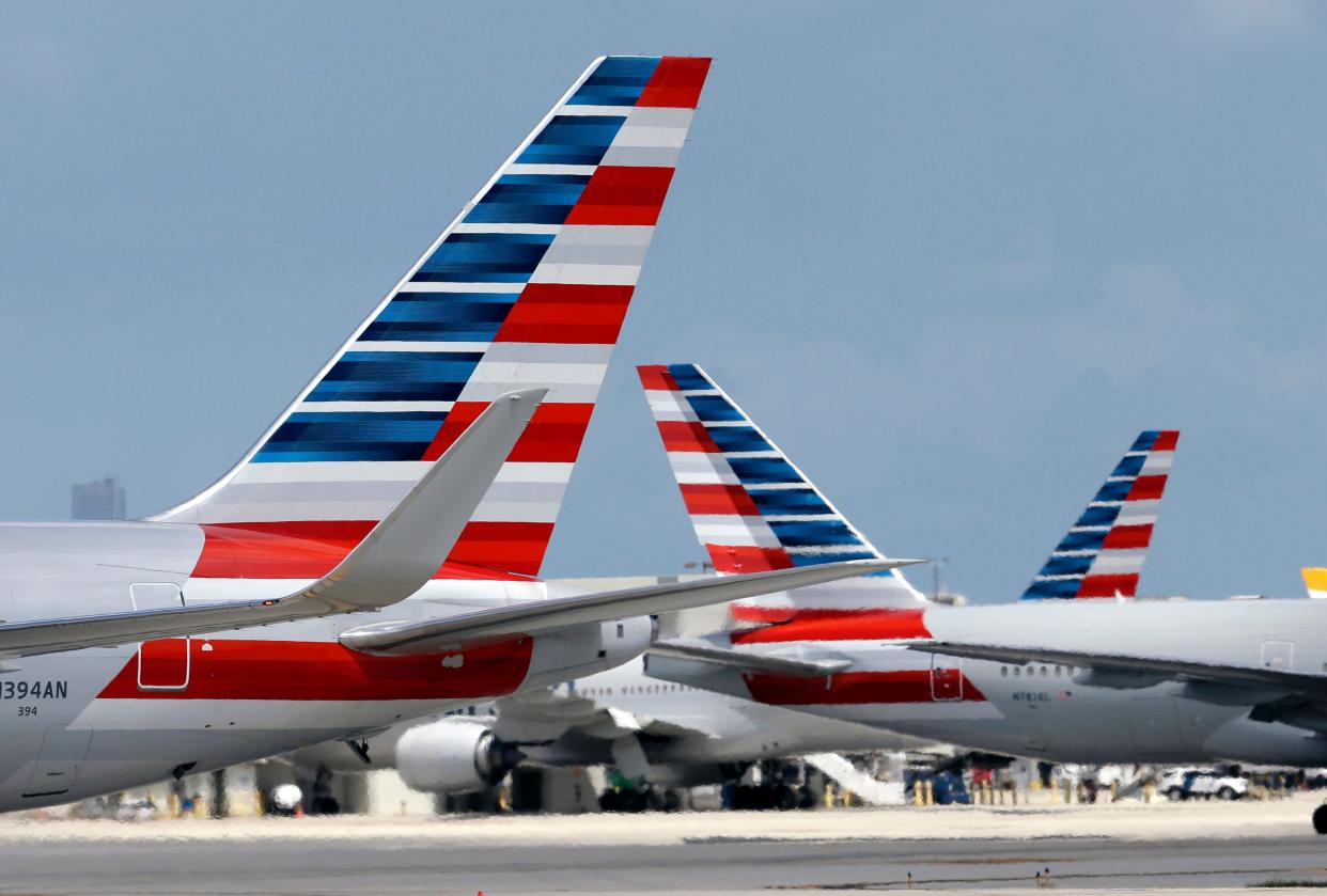 American Airlines jets taxi at Miami International Airport, in Miami.