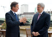 Prime Minister David Cameron talks with his Canadian counterpart Stephen Harper ahead of Mr Harper's address to the House of Commons in central London.