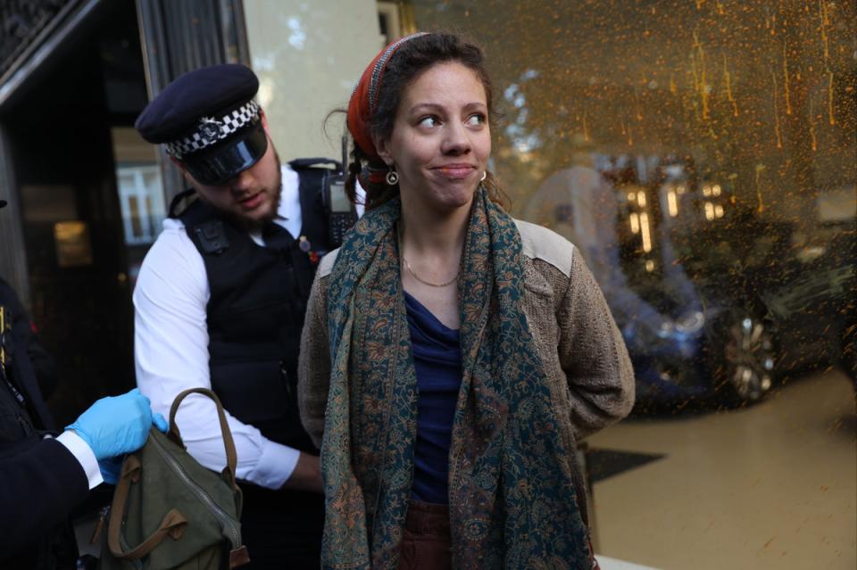 Police arresting Emma Brownon alongside other demonstrators from Just Stop Oil, following a protest at the Jack Barclay Bentley store in Berkeley Square, on October 26, 2022. (Getty Images)