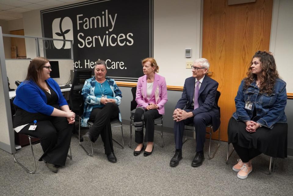 U.S. Sen. Tammy Baldwin and Wisconsin Gov. Tony Ever toured the 988 call center in April at Family Services of Northeast Wisconsin in Green Bay.