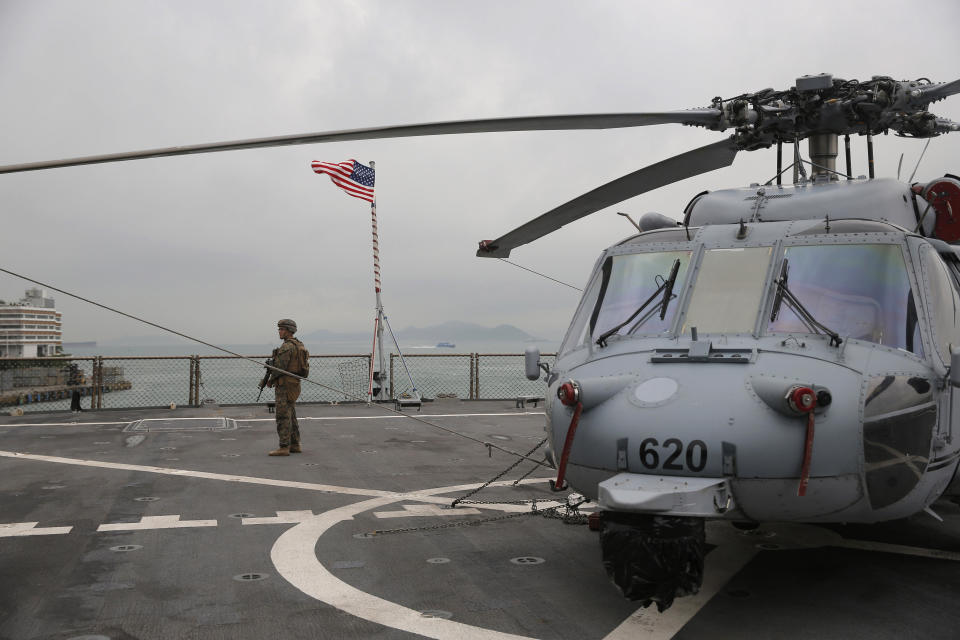 In this April 20, 2019, file photo, a U.S. marine patrols on the deck of the USS Blue Ridge, flagship of the U.S. Seventh Fleet, during a port call in Hong Kong, Saturday, April 20, 2019. (AP Photo/Kin Cheung, File)