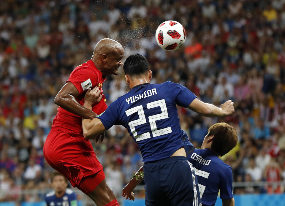 <p>Belgium’s Vincent Kompany, left, and Japan’s Maya Yoshida challenge for the ball during the round of 16 match between Belgium and Japan at the 2018 soccer World Cup in the Rostov Arena, in Rostov-on-Don, Russia, Monday, July 2, 2018. (AP Photo/Petr David Josek) </p>