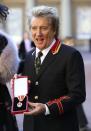 Singer Rod Stewart poses at Buckingham Palace after receiving a knighthood, in London, Britain, October 11, 2016. REUTERS/Gareth Fulller/Pool