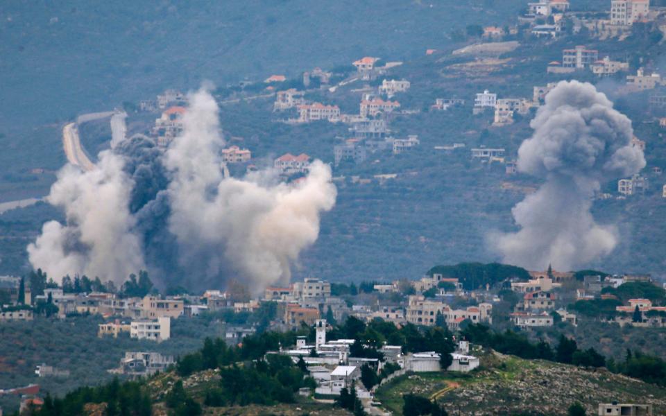 TOPSHOT - Smoke billows after Israeli bombardment over Lebanon's southern town of Kfar Kila near the border with Israel on December 21, 2023, amid ongoing cross-border tensions as fighting continues between Israel and Hamas militants in Gaza. (Photo by AFP) (Photo by -/AFP via Getty Images)