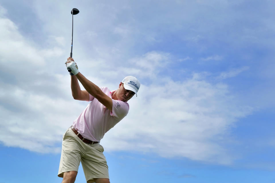 Justin Thomas hits from the first tee during the Tournament of Champions pro-am golf event, Wednesday, Jan. 1, 2020, at Kapalua Plantation Course in Kapalua, Hawaii. (AP Photo/Matt York)