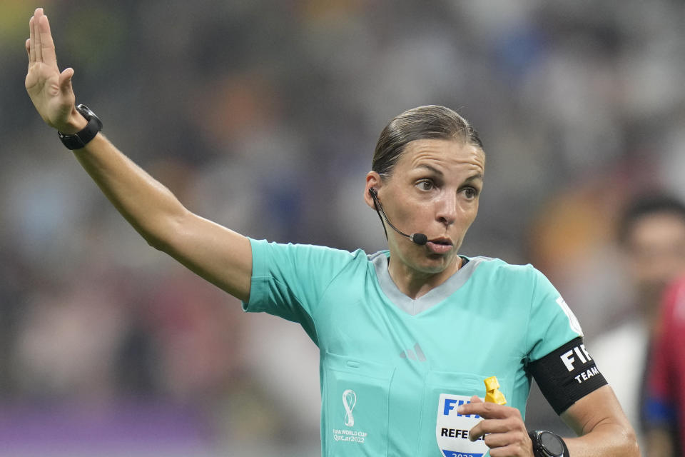 Referee Stephanie Frappart holds her arm up during the World Cup group E soccer match between Costa Rica and Germany at the Al Bayt Stadium in Al Khor, Qatar, Thursday, Dec.1, 2022. (AP Photo/Moises Castillo)