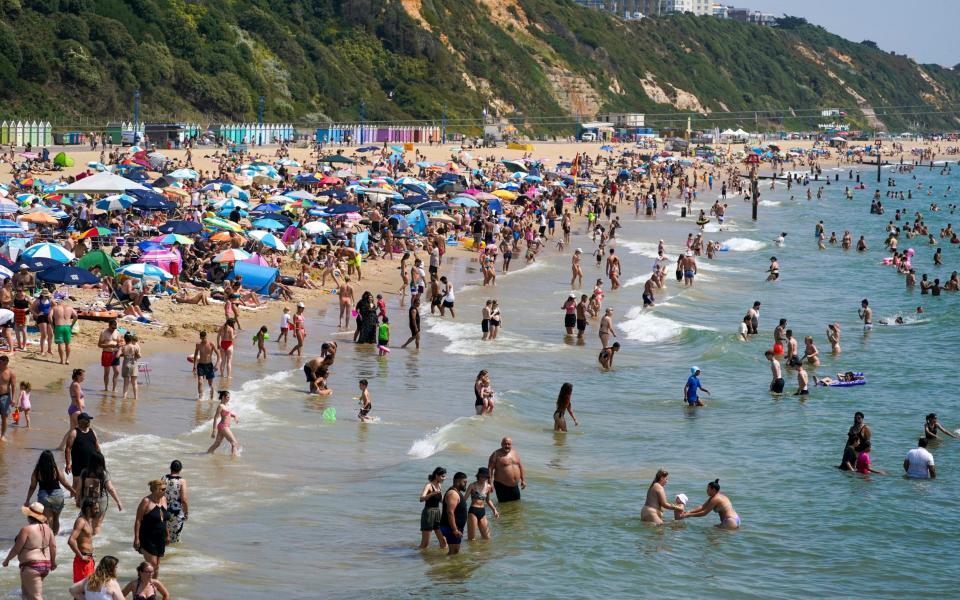 People on the beach in Bournemouth on July 19 2022, when temperatures hit 40C in parts of the UK - Steve Parsons/PA Wire