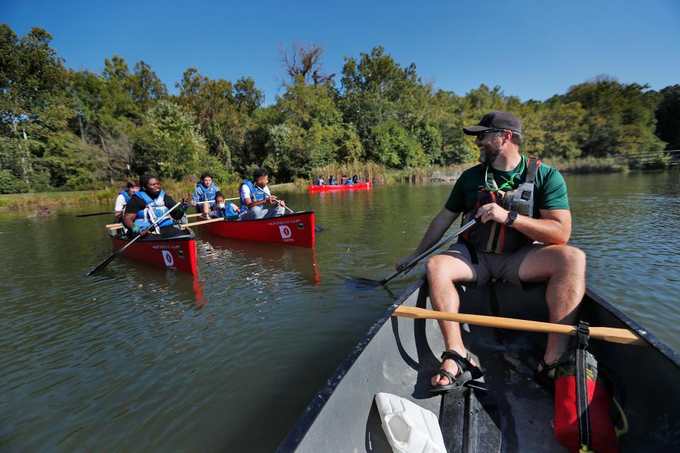 Brent Freeman, right, talks with with Lawrence North High School students as they canoe during a Camptown adventure activity Friday, Oct. 1, 2021 at Fort Benjamin Harrison State Park. Freeman is the executive director of the nonprofit which uses outdoor adventures to teach teens coming from difficult backgrounds the necessary life skills they need to survive. The different challenges and obstacles they face are meant to help them overcome their fears, recognize their strengths and learn to face adversity.